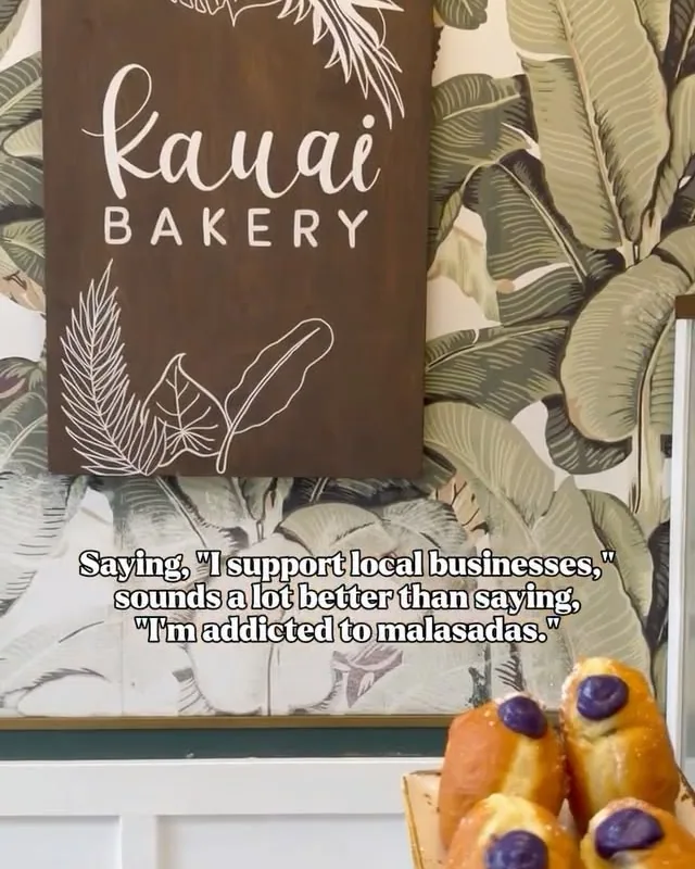 Ube malasadas beside the Kauai Bakery bag